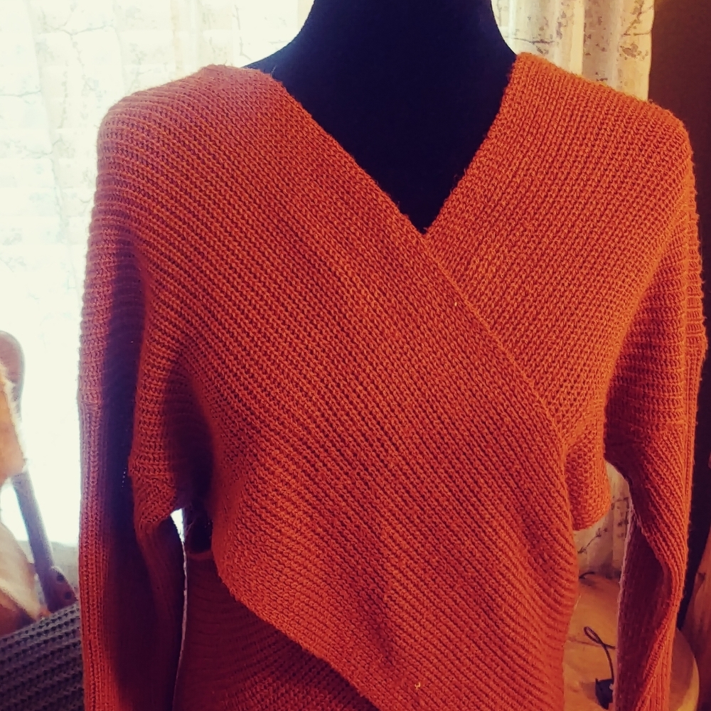 Sweater with cutouts and crossover